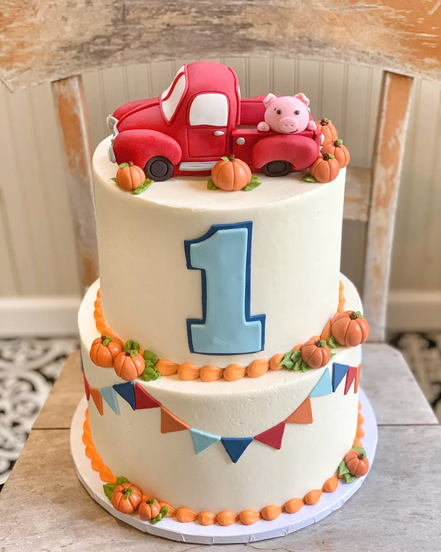 Autumn Harvest frosted cake with pumpkins and red truck